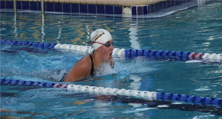 Senior Victoria Zembruski comes up for air while swimming the 100 meter breaststroke.
