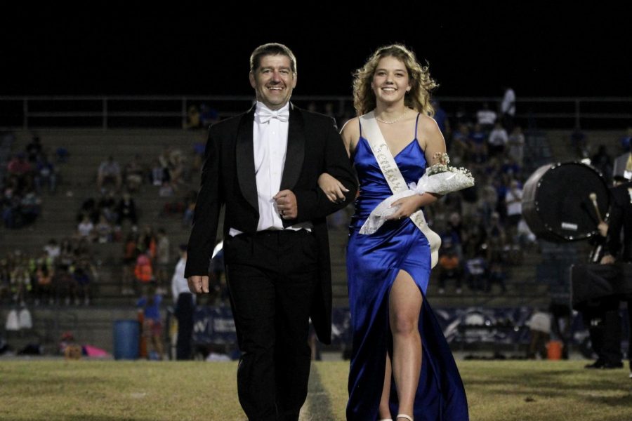 Roberts escorted down the football field at Dolphin Stadium by her father