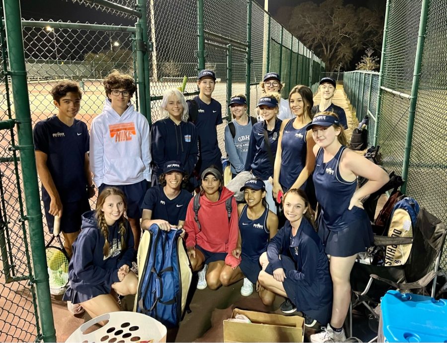 The JV tennis team celebrates a win at Milton last Wednesday. Both the boys and girls teams won.