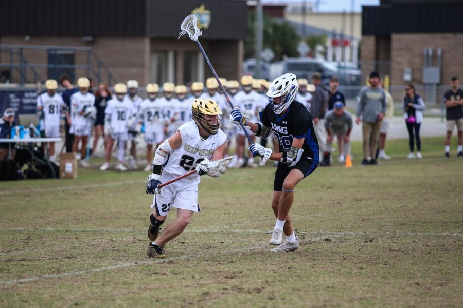 Senior John Valleto takes the ball up the middle to get in position to shoot against IMG which was ranked 23 in Florida.
