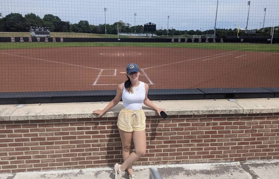 Presley stands at the baseball fields at Harvard University.
