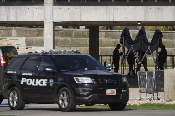 People clean up the scene at Utah Valley University on Sept. 12, 2025, in Orem, Utah, after Charlie Kirk was shot and killed. 